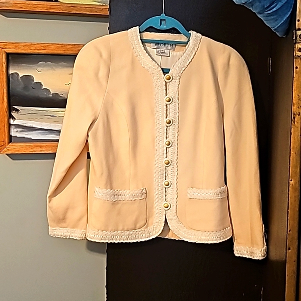 Worth cream blazer, size 6. Two sweet pockets. Gold tone on buttons and cuff.